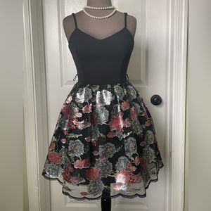 Black dress with sequin pattern skirt
